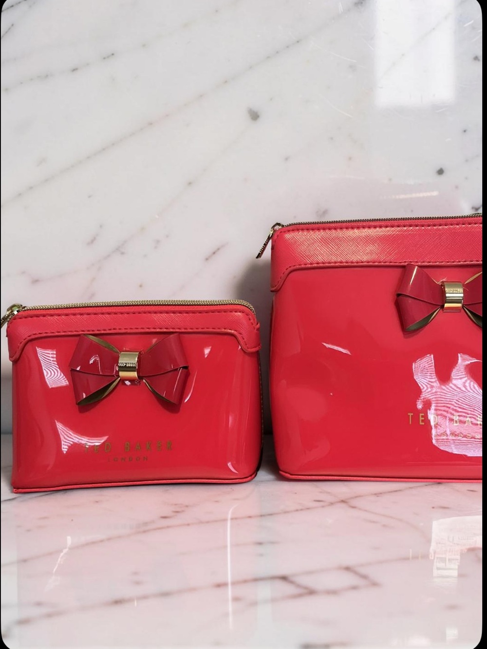 One small Ted Baker Coral-Fuchsia Patent Bow Fuchsia Cosmetic Case